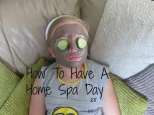 Girl with face mask on and cucumber over her eyes having a home spa day