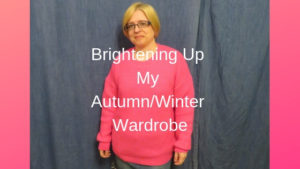 lady in pink jumper for Winter wardrobe