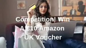 woman sat on sofa holding credit card and laptop for a competition