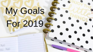 diary and notebook on desk for goals for 2019