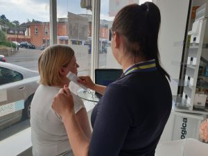 lady having a skin analysis done before a chemical peel