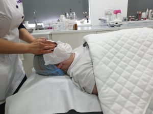 face being cleansed before a chemical peel