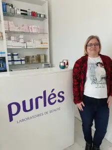 woman standing next to skincare counter after a chemical peel