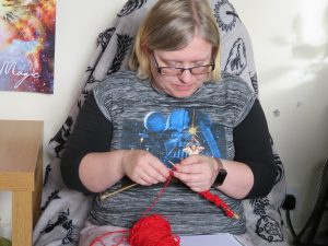 woman reading knitting pattern
