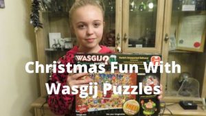 Girl holding wasgij Christmas puzzle