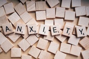 word tiles spelling out anxiety