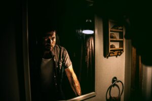 Man standing in front of mirror