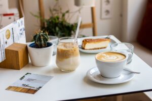 café with coffee cup and food on a desk