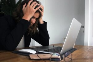 woman at laptop stressed