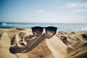 sunglasses on a beach: ways to look after yourself this summer