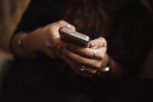 person using phone- tips to stay productive