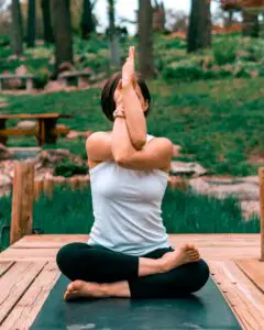 person doing outdoor yoga - lotus