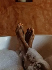 bubble bath with feet sticking out