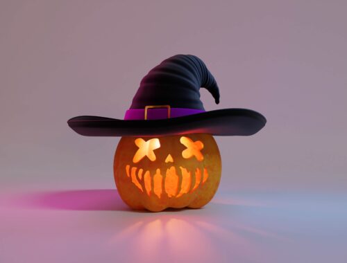 a carved pumpkin with a witch hat