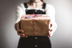 person holding a gift in front of them