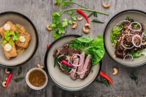 three plates of food on a table