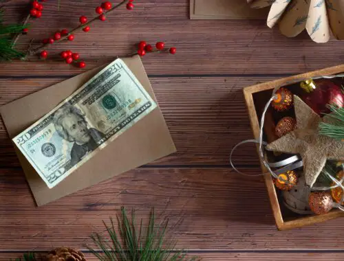 dollar bill with Christmas decorations - save money this Christmas